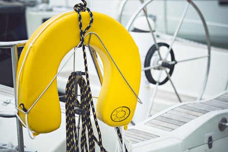a modern sailing ship yellow life jackets