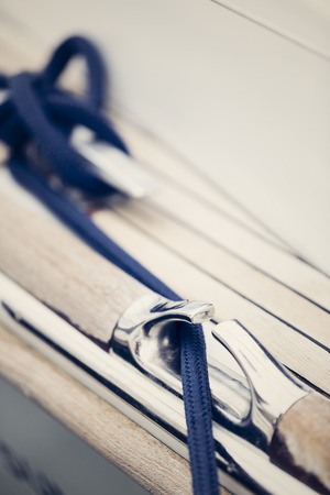 a modern sailing ship fixing his ropeの写真素材