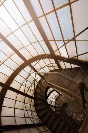 an old abandoned industrial building iron stairsの写真素材