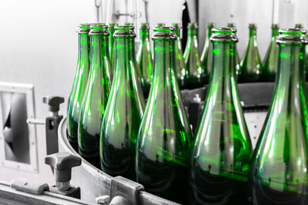 empty liquor bottles on the conveyor belt