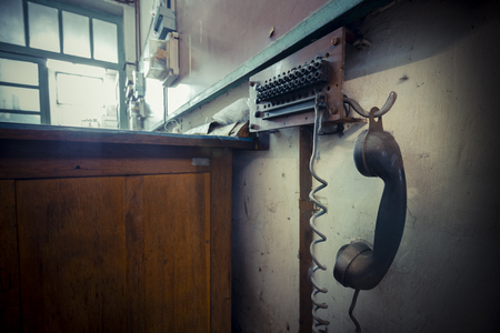 old landline phone in an abandoned factory, poor lightの写真素材