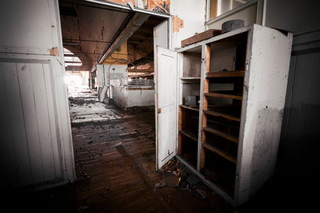 Old, dirty office furniture in an abandoned factoryの写真素材