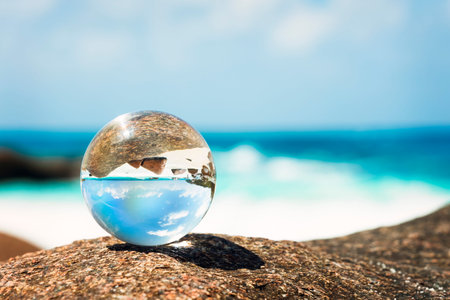 a glass globe on the beach