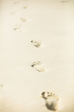 human footprints on the beach sandの写真素材
