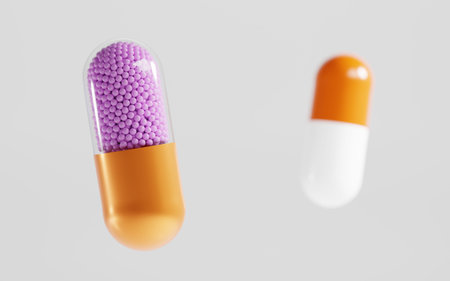 Transparent colorful capsules with granulated filler, isolated on white background. Medical pills,...