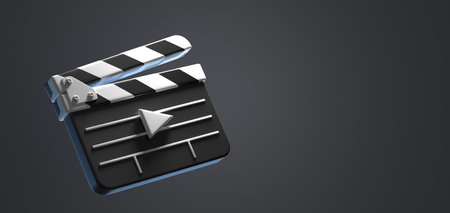 Film clapperboard with play video icon isolated on dark background, angle view. Cinema production, clapper for shooting scenes and takes in cinematography, movie industry signの写真素材