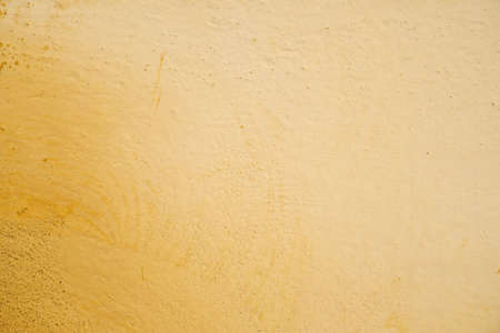 Yellow wall with old cracked paint.の写真素材