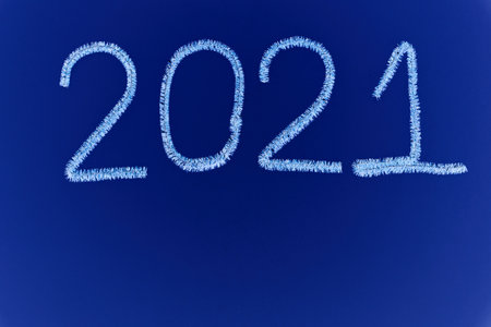 New year 2020 inscription made of white tinsel with a blue background.の写真素材