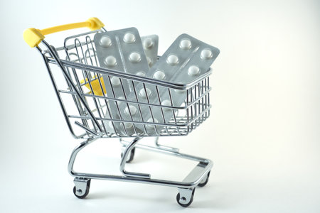 Pills in a shopping cart. Copy space.の写真素材