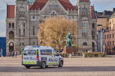 HELSINKI, FINLAND - APRIL 30, 2021: A police car at Helsinki railway station square.のeditorial素材