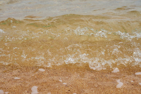 Sea water on the sandy shore.の写真素材