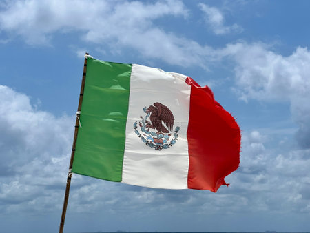 Mexican flag on a flagpoleの写真素材