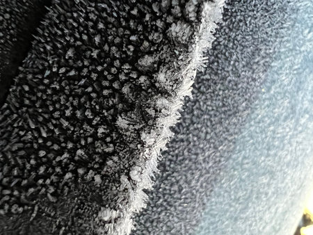 The car was covered in ice in the freezing cold