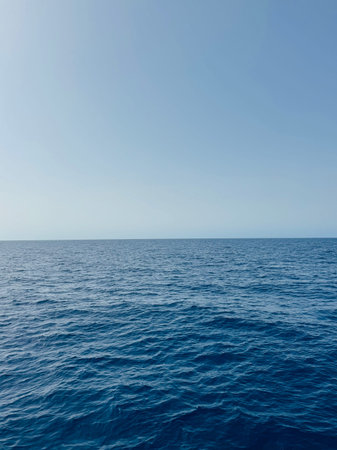 The blue sea and the horizon of the blue clear sky. High quality photo