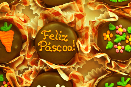 Black chocolates with Happy Easter written in Portuguese