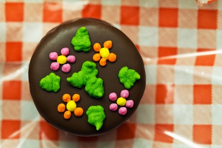 Chocolate candy handmade over a plaid paper in macro detailの写真素材