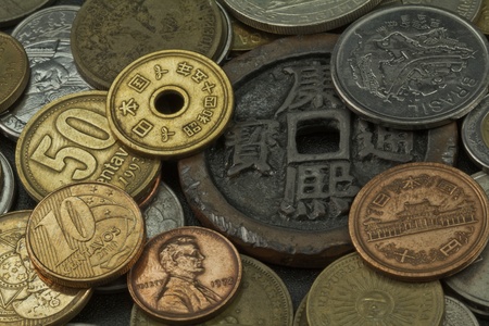 Old coins of several countries and colorsの写真素材