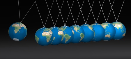 Newton cradle balancing with earth balls over blackの写真素材