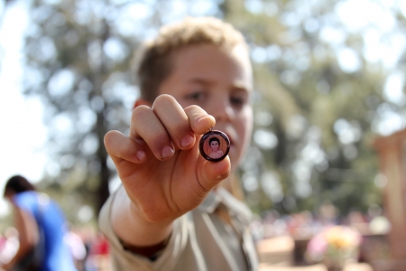 MARACAI, SAO PAULO BRAZIL - AUGUST 26  An unidentified boy showing a medal at the annual religious pilgrimage of  Menino da Tabua  festival that attracts 15 000 visitors by year on August 26, 2012 in Maracai, Sao Paulo, Brazil のeditorial素材