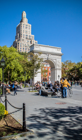 NEW YORK, USA, October 10, 2015: Unidentified people walking and resting in Washington Square Garden in Manhattan, New York.のeditorial素材