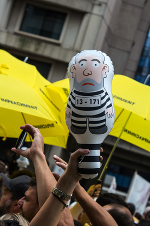 Sao Paulo Brazil March 13, 2016: One unidentified group of people in the biggest protest against federal government corruption in Sao Paulo with an inflated doll called pixuleco.のeditorial素材