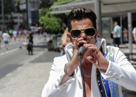 Sao Paulo, Brazil March 6, 2016: An unidentified street singer at Paulista Avenue dressed like Elvis Presley in Sao Paulo, Brazil.のeditorial素材