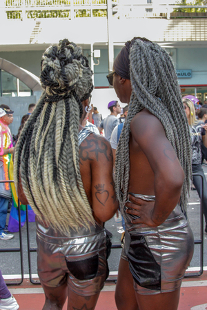 SAO PAULO, BRAZIL - June 18, 2017: Unidentified young black men dressed in a costume celebrating lesbian, gay, bisexual, and transgender culture in the 21st Gay Pride Parade Sao Paulo.のeditorial素材