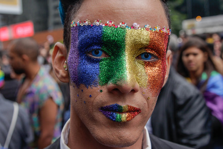 Sao Paulo, Brazil - June 3, 2018: An unidentified man with face painted celebrating the lesbian, gay, bisexual, and transgender culture in the 22th LGBTI Pride Parade Sao Paulo.のeditorial素材