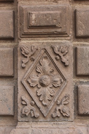 Colonial Catholic church wall architecture detail in Cuzco Peru. Carved in stone by hand.の写真素材