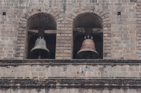 Colonial Catholic church bells architecture detail in Cuzco Peru. Carved in stone by hand.の写真素材