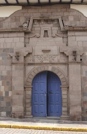 Detail of an old catholic church facade in Cuzco Peru. Old door.の写真素材