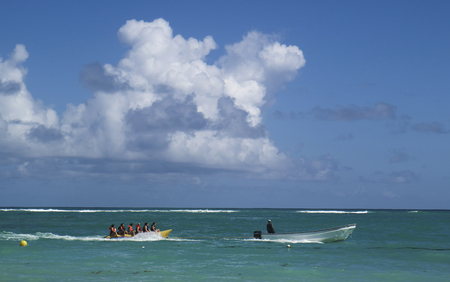 Punta Cana, Dominican Republic - October 22, 2018: Unidentified people inside a boat sailing near of Bavaro beach at Punta Cana region in a sunny day.のeditorial素材