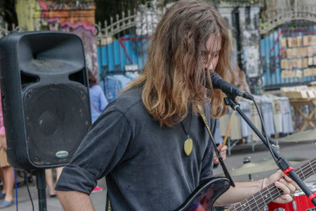 Sao Paulo, Brazil - February 17,2019: Unidentified man playing rock with a band on the Paulista...