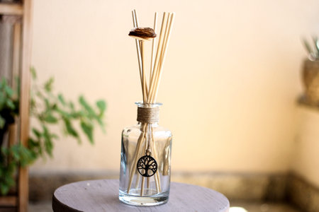 Aromatic air freshener in a transparent glass bottle with life tree symbol for decoration