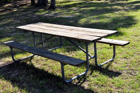  A old picnic table setting unused in the outdoors.の写真素材