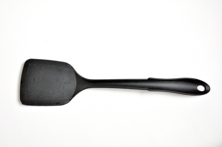 A spatula is  laying on a white background.の写真素材