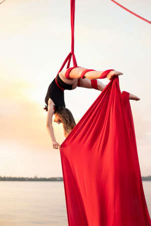 beautiful girl aerialist is engaged on canvasesの写真素材