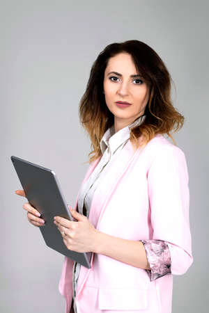 girl holding a tablet in her handsの写真素材