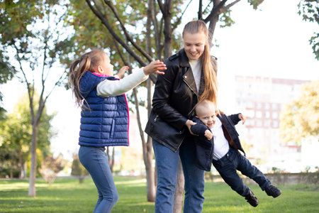 family have fun in the park, mom and kidsの写真素材