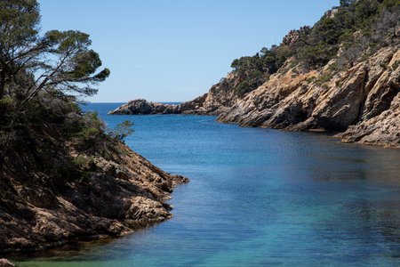 Hidden cove with turquoise water, Tossa de Mar. Beautiful seascapeの写真素材