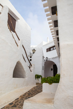 Picturesque alley with traditional buildings in Menorca, Spainの写真素材