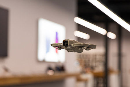 Unmanned aerial vehicle, innovation and aerial photography. Modern drone indoors, technologies of the futureの写真素材