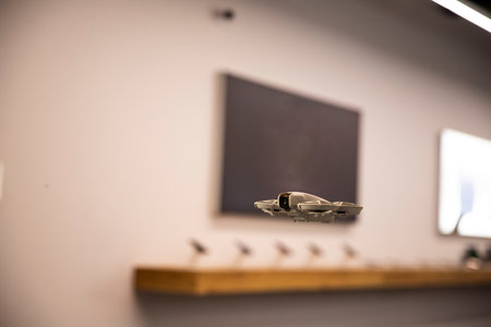 Technologies in action, drone with a camera indoors. Flying gadget, drones' prospects for business. Macro, space for text nearbyの写真素材