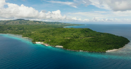 Aerial shots of this Magnificent Island surrounded by calm and deep blue sea water. Siquijor, Philippines.の写真素材