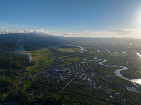 Beautiful aerial view of Riverbanks in Tropical Island with sunlight. Mindanao, Philippines.の写真素材