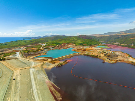 Drone survey of nickel mine with a dark red water. Natural resources. Mindanao, Philippines.の写真素材