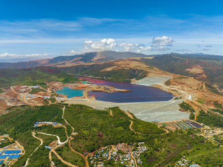 Nickel mining with forest in surroundings and villlages. Environtmental resources. Mindanao, Philippines.の写真素材