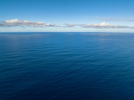 Flying from above of Deep Blue Sea. Skyline over the sea. Surigao del Sur. Mindanao, Philippines.の写真素材