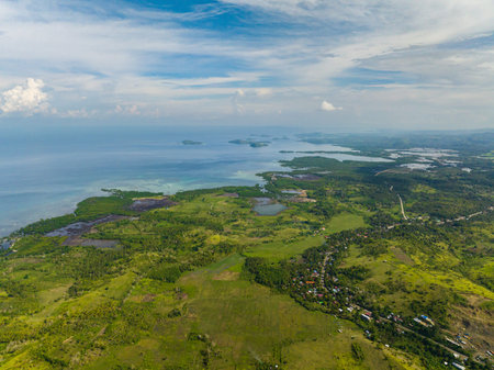 Farming and growing plants in rural areas of Mindanao. Blue sky and clouds. Philippines.drone...