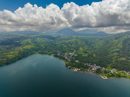 Lanao del Sur: Lake Lanao and mountain with rainforest and town. Mindanao, Philippines.の写真素材